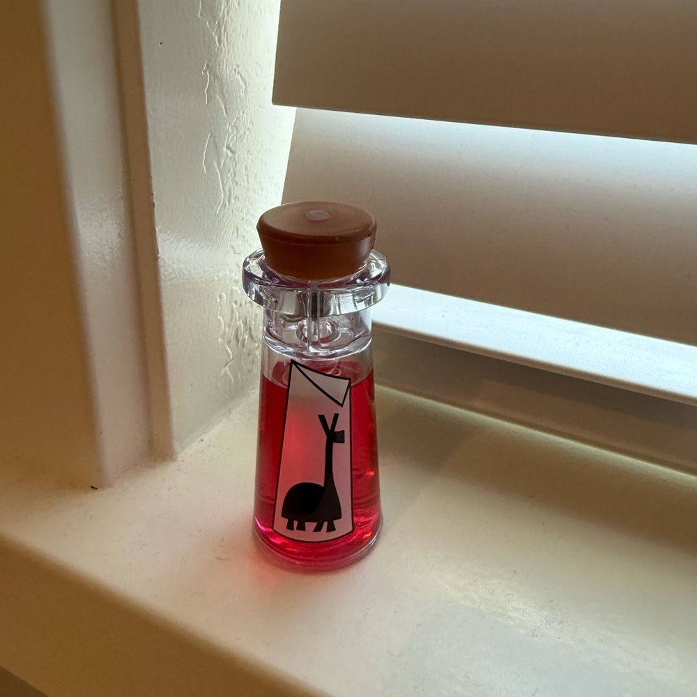 Emperors New Groove Glow Cube/Potion Bottle from Disneyland